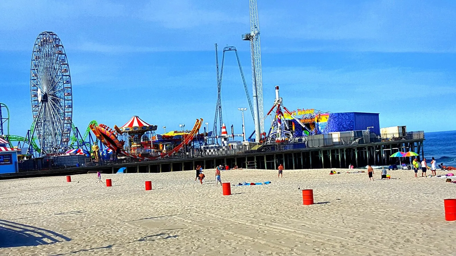 Casino Pier's Ferris wheel and roller coaster above the beach at Seaside Heights on the Jersey Shore
