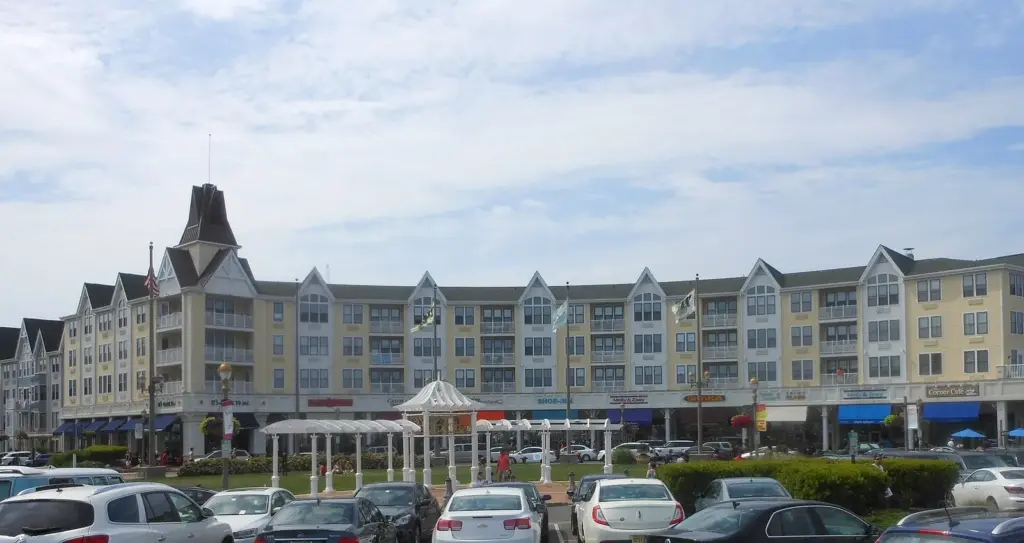 Pier Village in Long Branch, a row of four-story shingled buildings with shops and restaurants on the ground floor and a gazebo in front