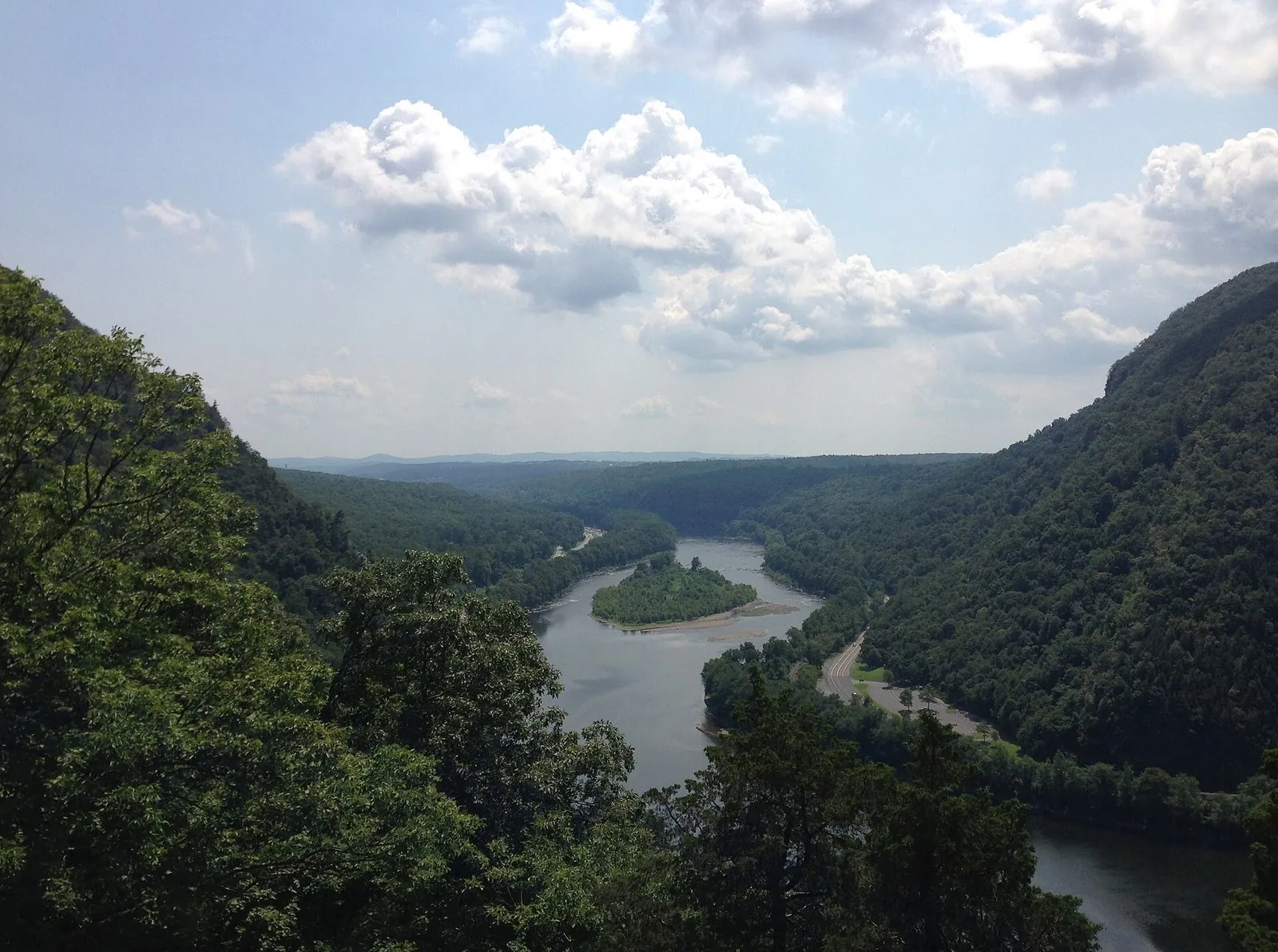 The Delaware Water Gap seen from the Mount Tammany trail, the Delaware River curving around a wooded island between two steep forested ridges